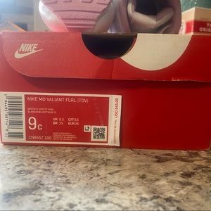 Little girls Nike shoes.